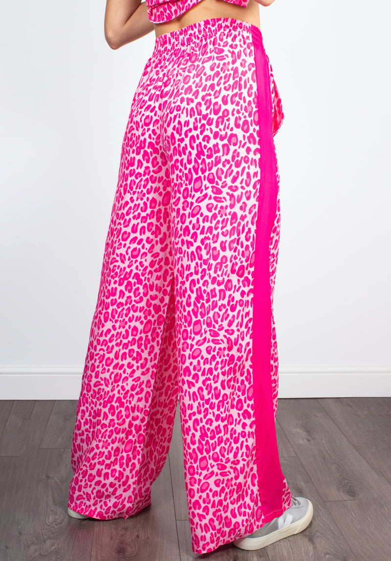 Kylie leo-print pink silk-blend trousers